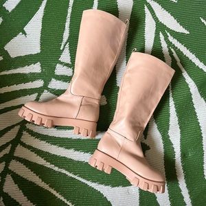 Tall pull-up boots with a chunky, motorcycle biker, combat, thick lug sole.